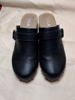 MIA women's black studded clogs with a buckle strap